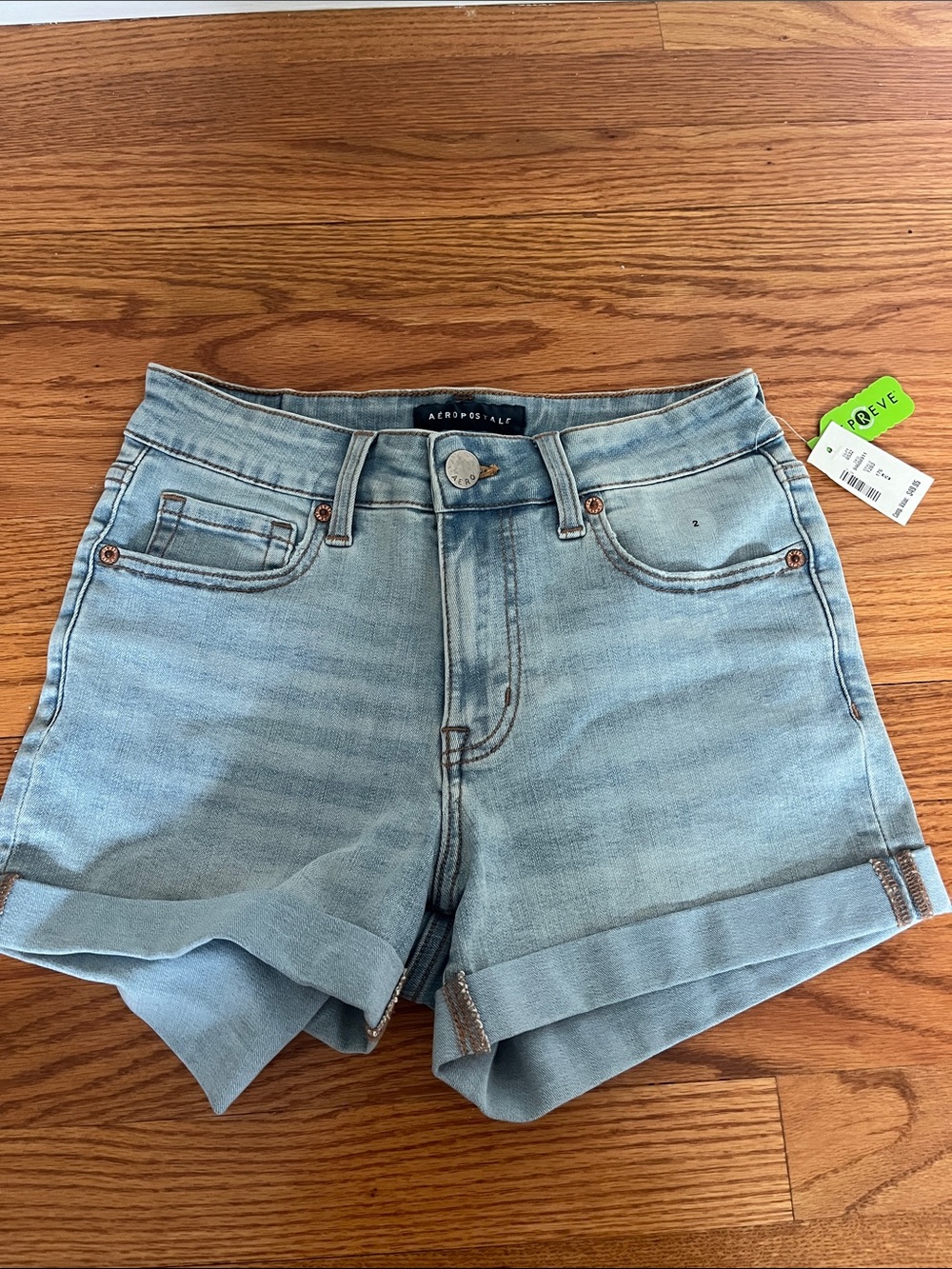 Women’s high-waisted midi light wash jean shorts
